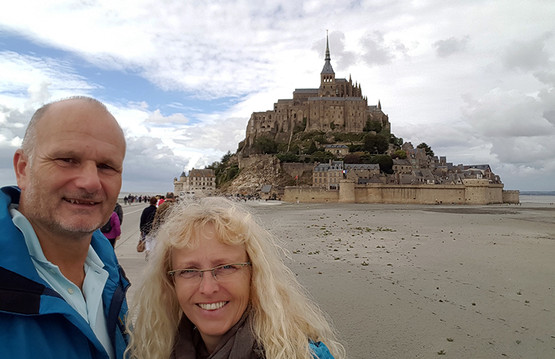 Dieter Stegmeier with his wife Maria in front of Mont Saint-Michel