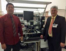 VadaTech SMT Production Manager Jay Motiwala (left) and Ersa Sales Manager Jean Verchere (right) in front of a HR 600 Rework System